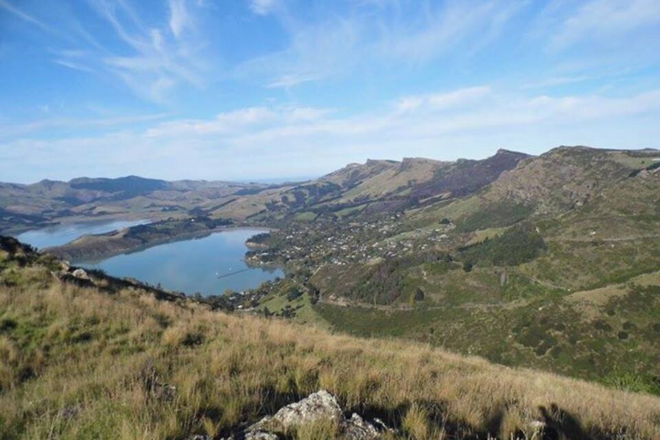 A lake surrounded by hills and a small town.