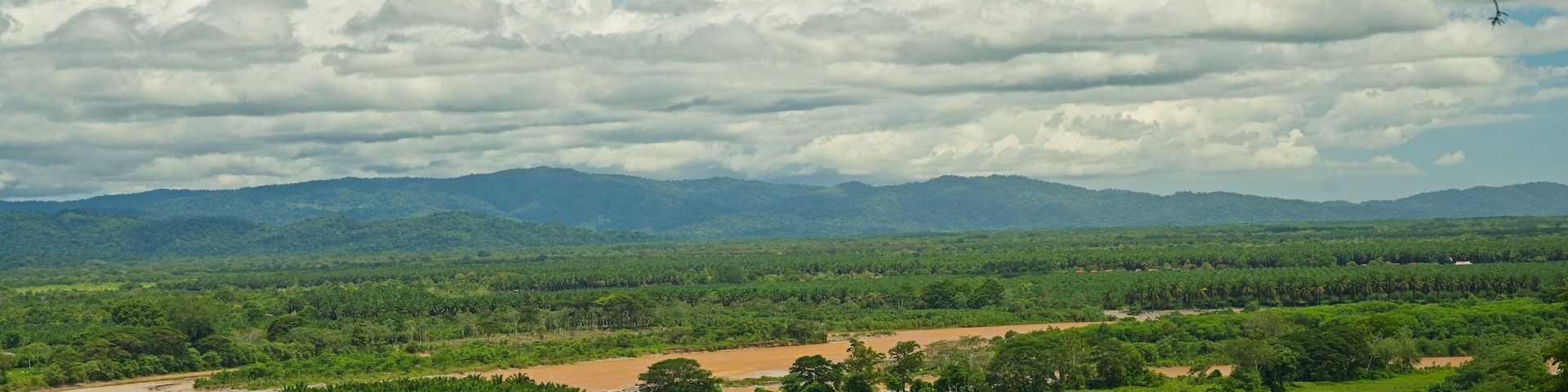 view to the Rio Terraba river and the Osa peninsula near Palmar Sur in Costa Rica