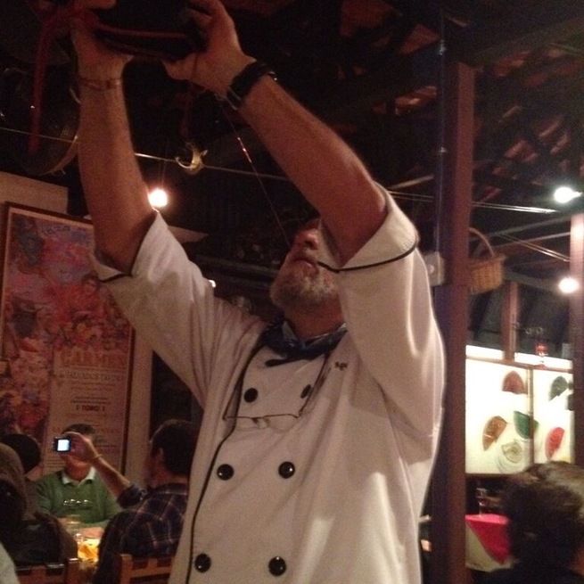 The owner of this Spanish restaurant, teaching us how to drink