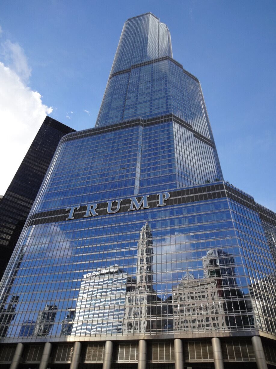 The Trump International Hotel and Tower, or Trump Tower Chicago was completed in 2009 and tops out at 1,389 feet making it the 2nd tallest building in Chicago. The TRUMP sign across the building consists of 20ft tall letters, spanning almost 150ft. The sign is currently a very polarizing symbol in the skyline. The construction site of the tower was the setting for the Joker vs Batman duel in "The Dark Knight".