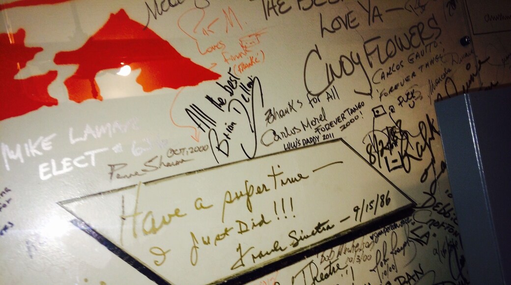 Autographs line the back staircase to the artists' waiting room. Great history before you!