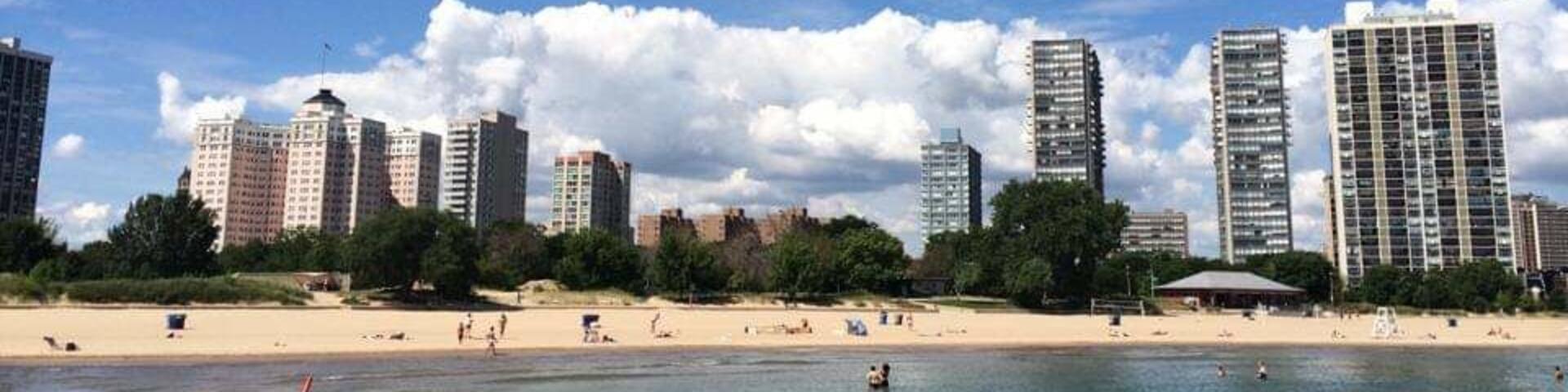 From the gay beach at Kathy Osterman Beach looking towards Chicago's Edgewater neighborhood! On the left is remaining building of the historic Edgewater Beach Hotel complex! #LifeAtExpedia