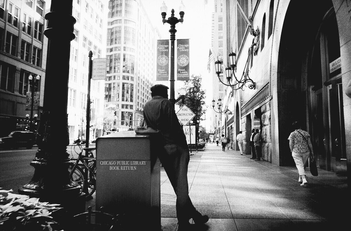 Just walking the streets, and shooting from the hip. Waiting out for that "decisive moment". I think this one is golden. Shot in front of the Chicago Public Library.