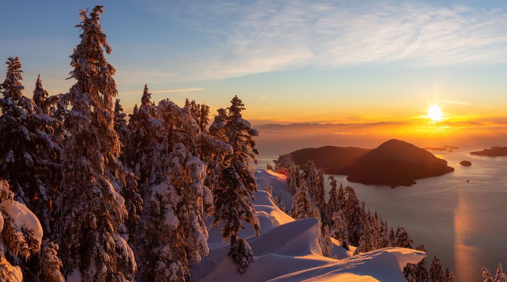 Beautiful Panoramic Canadian Landscape view during a colorful winter sunset. Taken from top of Mnt Harvey, North of Vancouver, BC, Canada.
