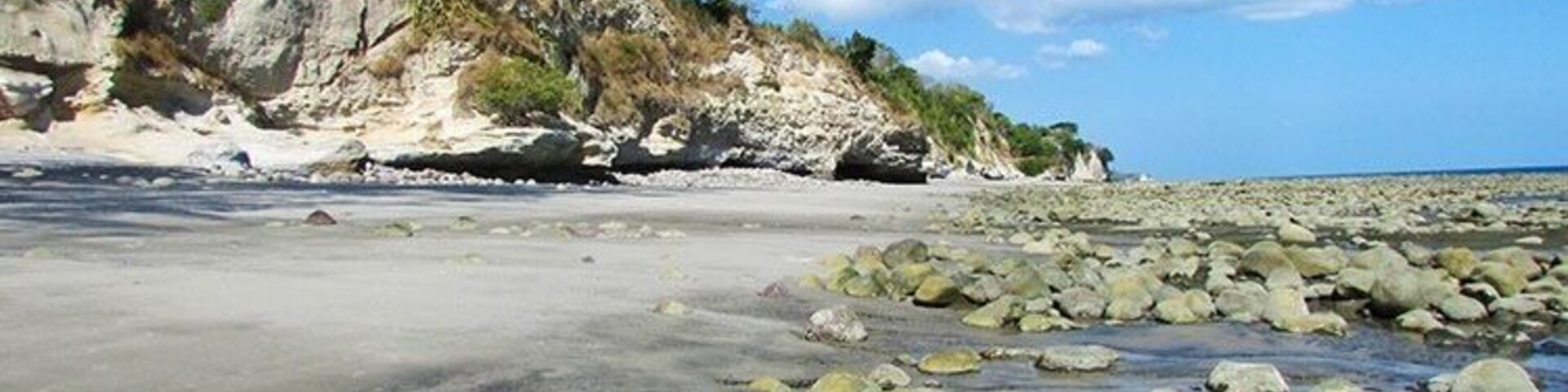 Cliffs and tide pools make for an interesting beach. You'll have it all to yourself. Except for a few cows.