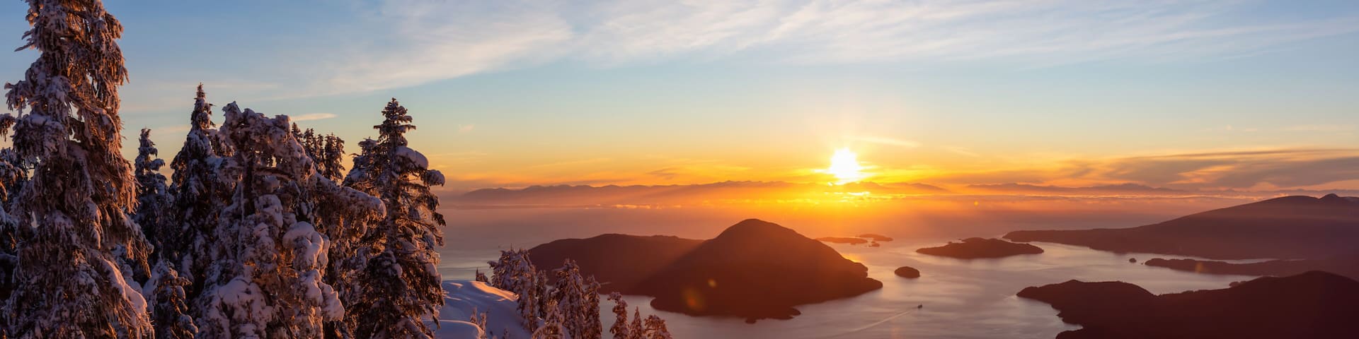 Beautiful Panoramic Canadian Landscape view during a colorful winter sunset. Taken from top of Mnt Harvey, North of Vancouver, BC, Canada.
