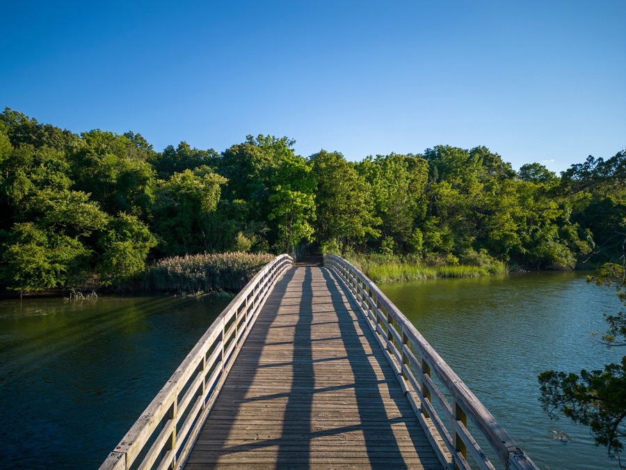 Drone view of the wooden bridge looking toward the picnic area of Sunken Meadow State Park