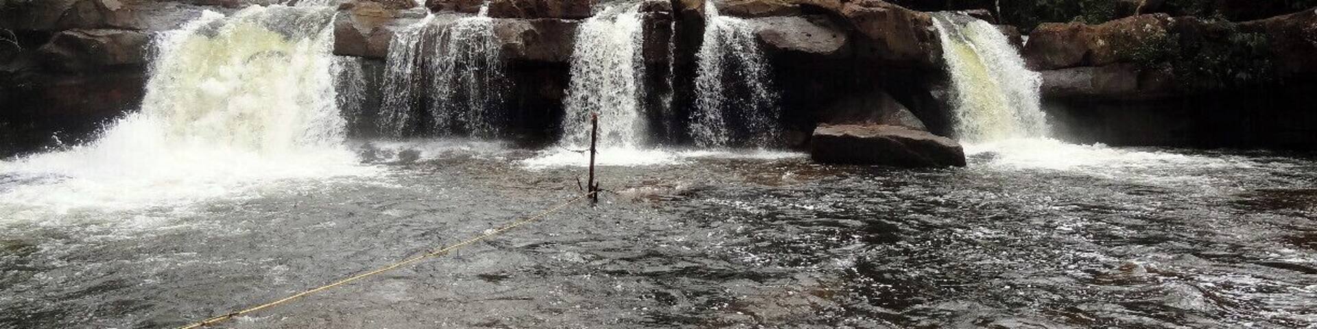 Koh Kong is a rough around the edges, border town whose bus station will leave you wondering if this is really somewhere you want to get off. Do it though. After you check in make a beeline to find Mr. T at Koh Kong Eco Tours. This guy will get you everything you need including moto rentals and guides to hidden places such as this waterfall deep in the Cardamom Forest.
To get here, you'll need to put your big boy/girls pants on. Its steamy and much of the trail involves bushwacking. You'll also be battling leeches and other critters, but the guides are more than competent and the chance to have your own private waterfall for the day is well worth the effort.
Tip: Mr. T will have lunch brought out for you so skip the heavy bags and enjoy the hike.