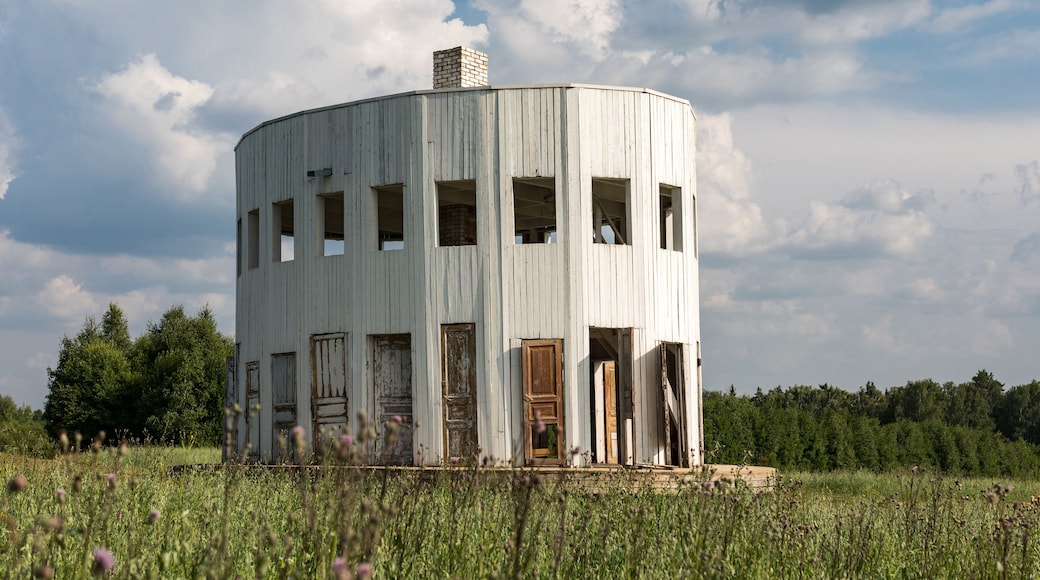 White wooden rotunda with many doors