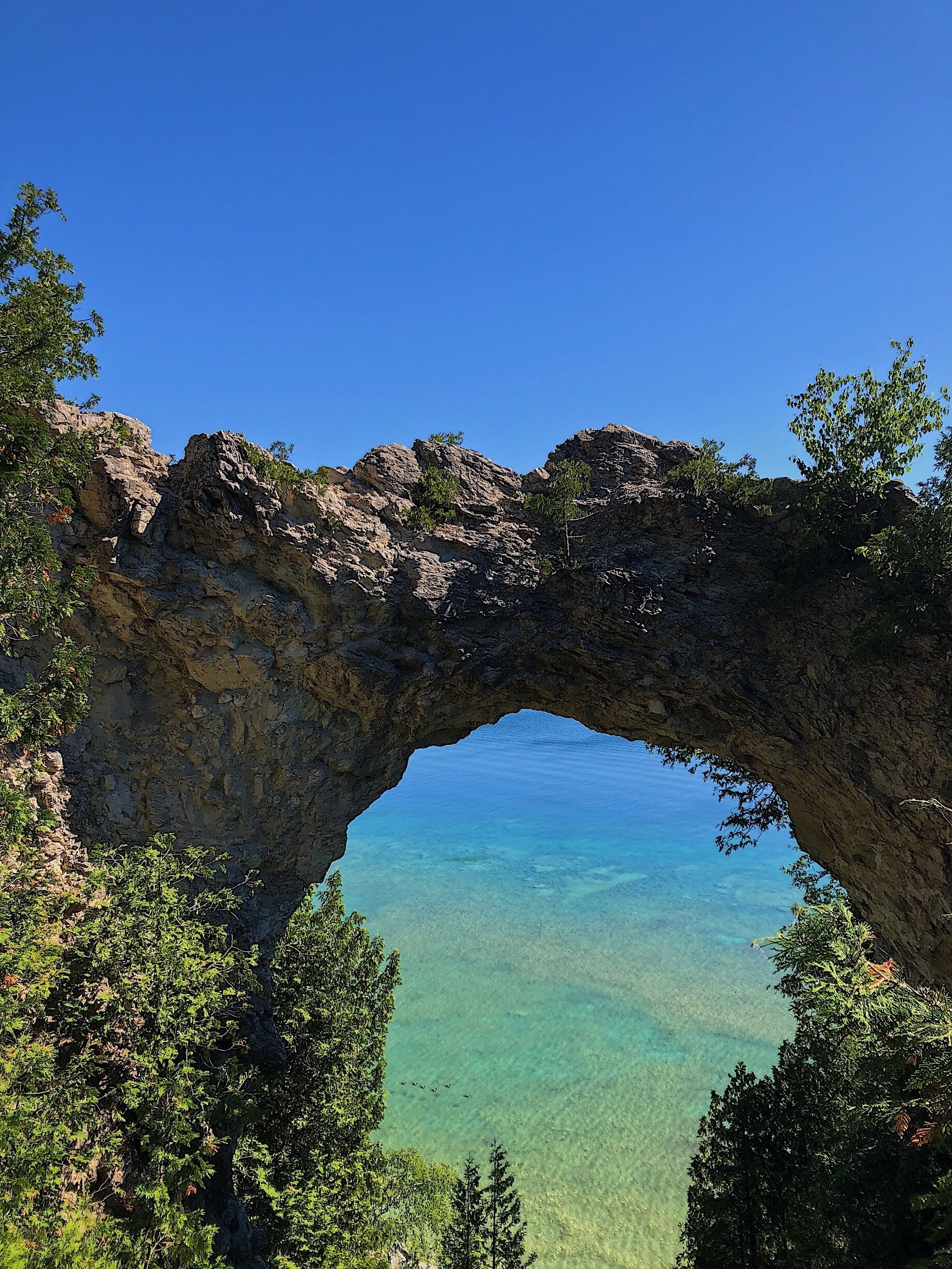 Arch rock overlooking beautiful lake Heron on Mackinac Island