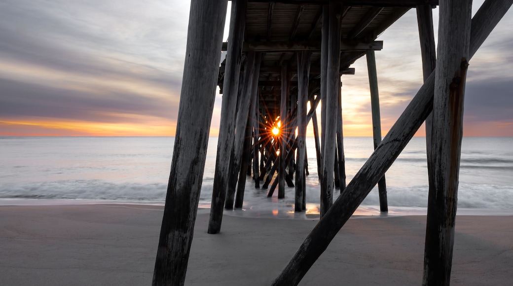 Sunstar at Sunrise Through Wooden Pilings of Belmar Fishing Pier, New Jersey
