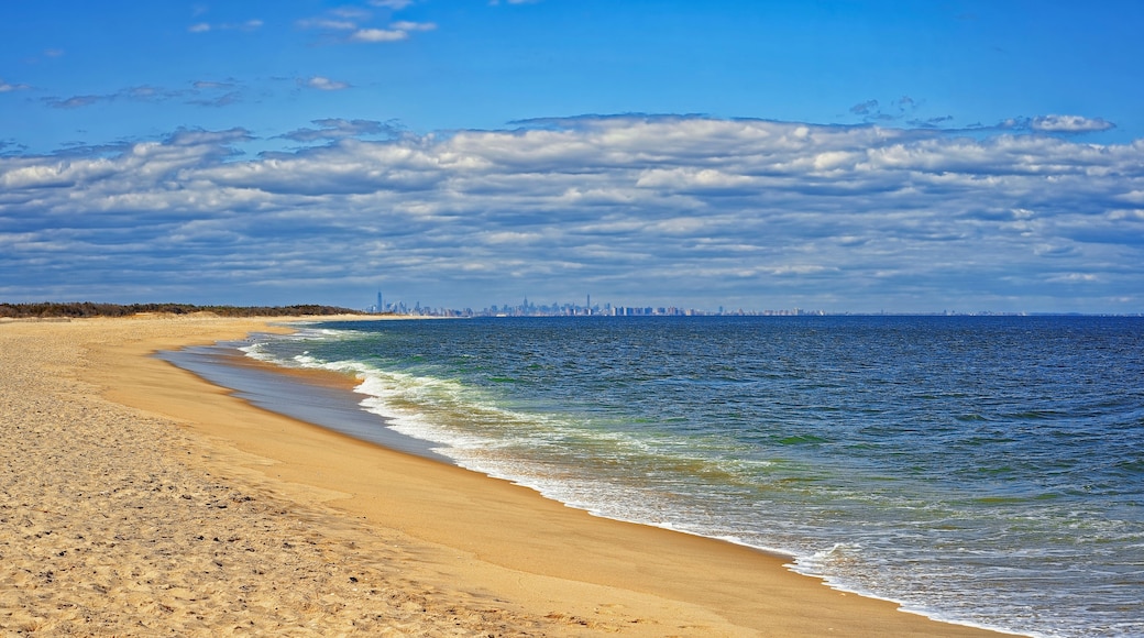 Ocean shore and view to NYC skyline landscape from Sandy Hook, New Jersey