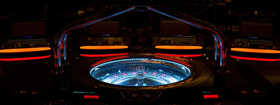Casino machines in the entertainment area at night waiting for gamblers to come, play and bet.