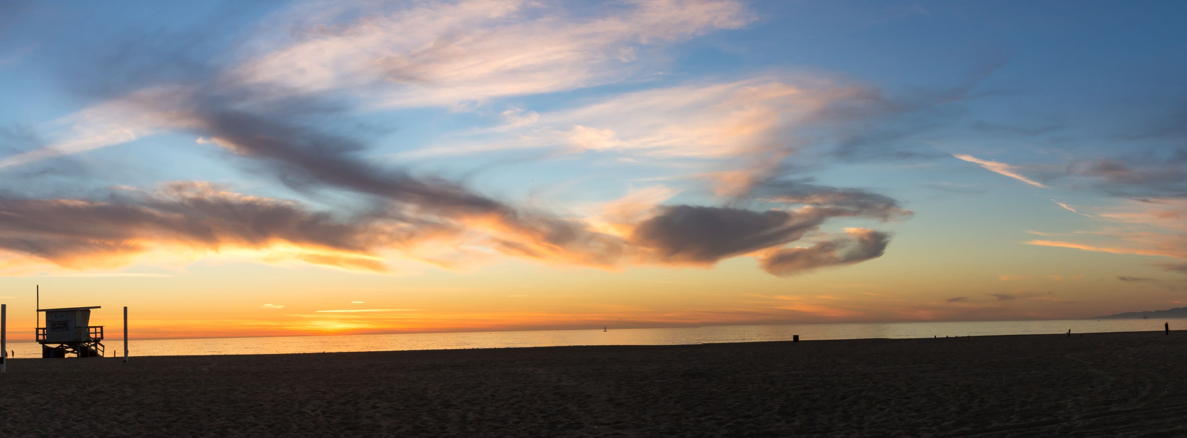 Panoramic view of sunset with lifeguard tower in Hermosa Beach California