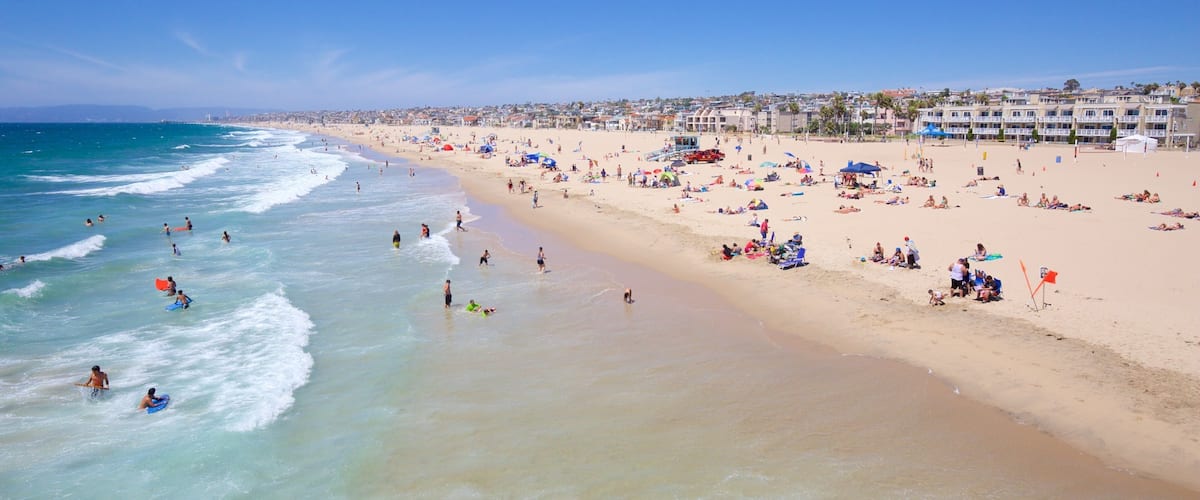 Hermosa Beach showing a sandy beach and general coastal views as well as a large group of people