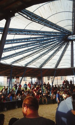 Crowd watching a wrestling match in rural Georgia. View from the village of Metekhi.
