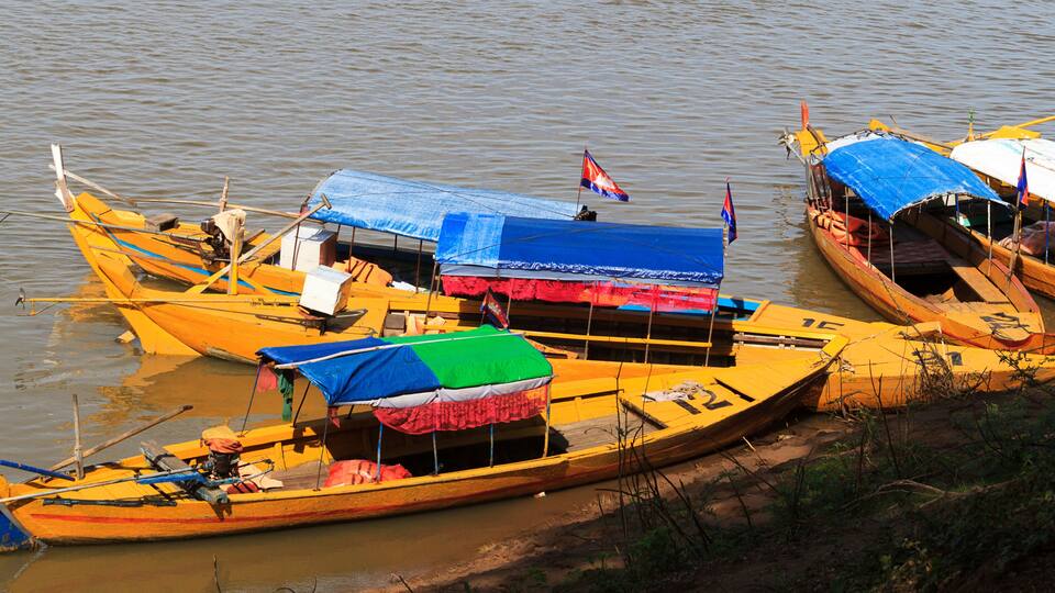 Kratie, Cambodia. Tour sampans waiting to to take people to see the rare freshwater Irrawaddy dolphins.
