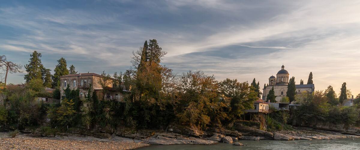 The Rioni River embankment in the city Kutaisi, Georgia. Sunset cityscape