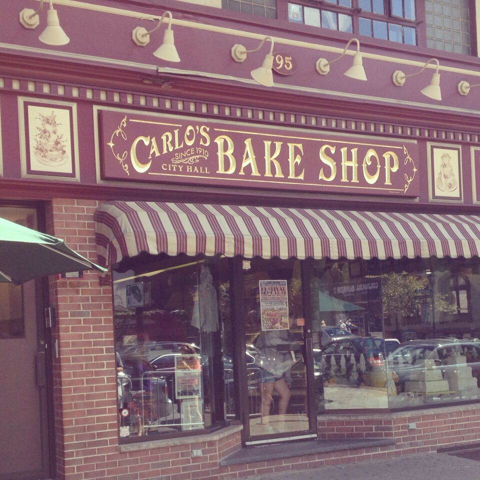 Carlo's Bakery is the one from the TV show Cake Boss. There is a line outside to get in since it is so small and so popular.