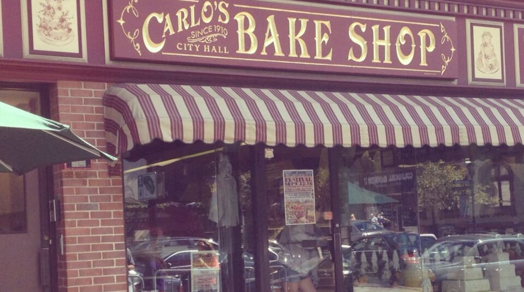 Carlo's Bakery is the one from the TV show Cake Boss. There is a line outside to get in since it is so small and so popular.