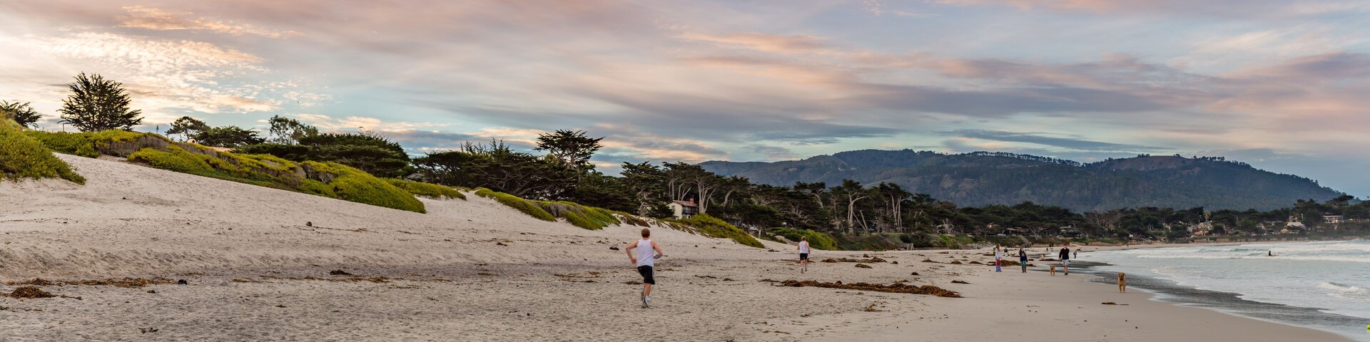 Panorama of a Jogger on the beach at Carmel Cove