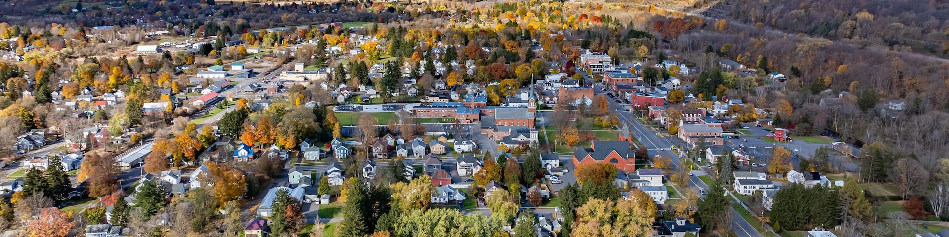 Aerial photo of fall foliage surrounding the Village of Homer, Cortland County, New York State, October 2024.