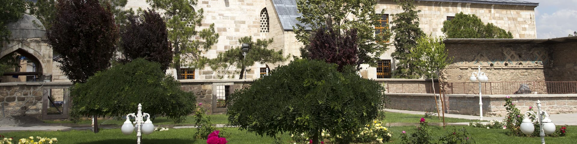 Tomb of Mevlana, the founder of Mevlevi sufi dervish order, with prominent green tower in Konya, Turkey