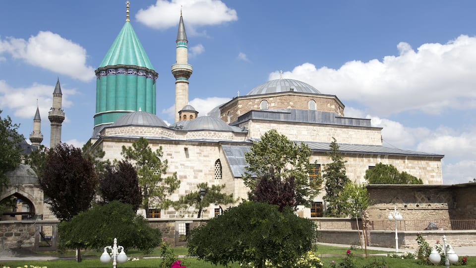 Tomb of Mevlana, the founder of Mevlevi sufi dervish order, with prominent green tower in Konya, Turkey
