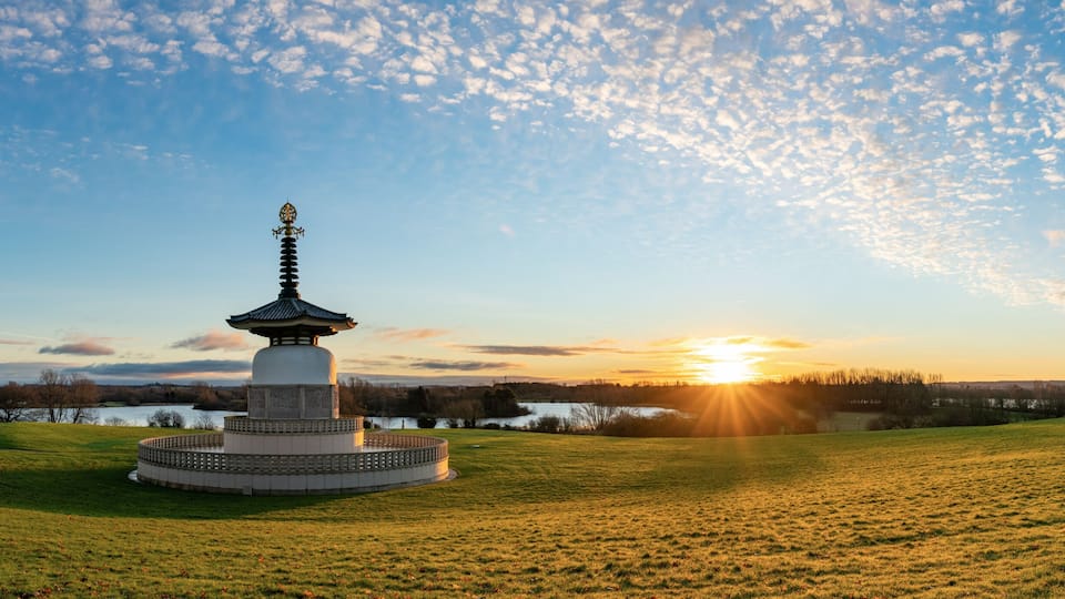 Panorama of Peace Pagoda temple at sunrise in Willen Park, Milton Keynes, UK