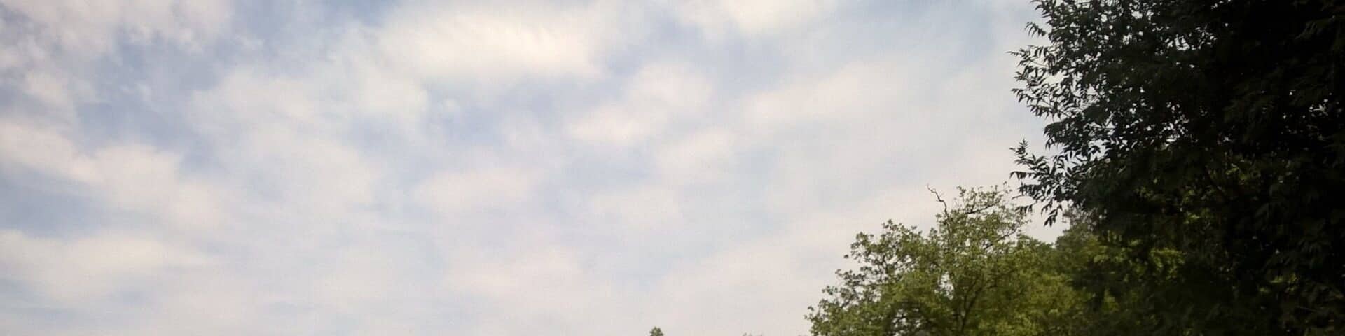 Driving down a dirt road, an old fortress called Kuhluti is visible in the distance.
View from rural Kvemo Kartli in the country of Georgia.