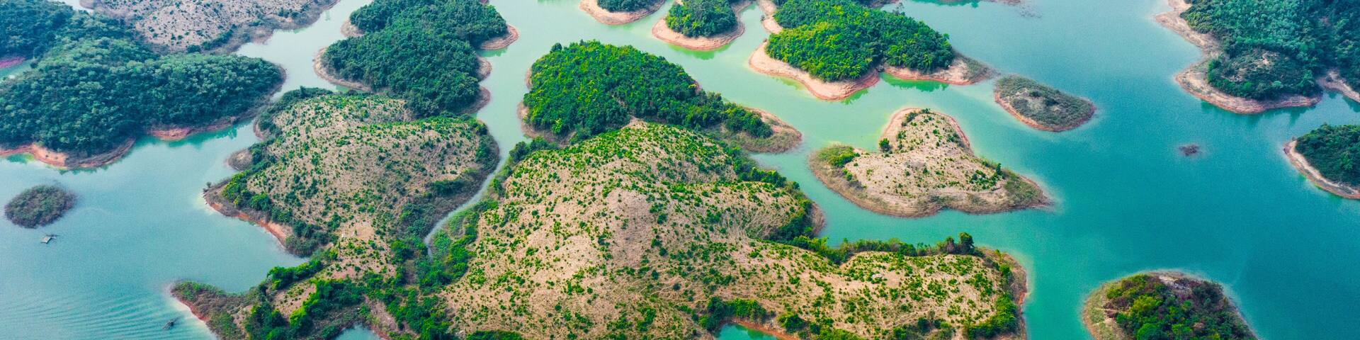 (View from above) Stunning aerial view of a beautiful group of island in Nam Ngum Reservoir in Thalat located in northern Laos.