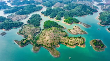 (View from above) Stunning aerial view of a beautiful group of island in Nam Ngum Reservoir in Thalat located in northern Laos.