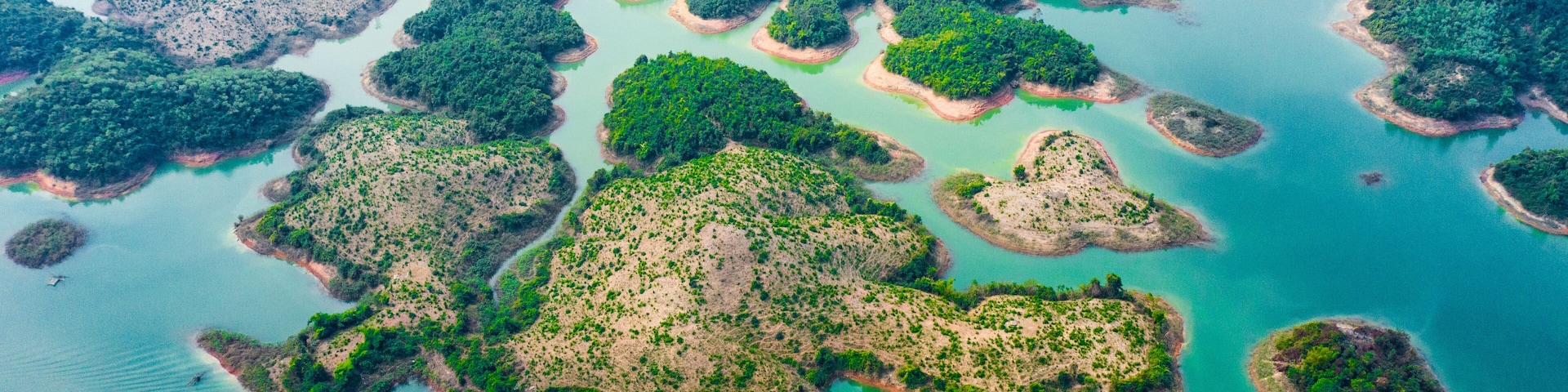 (View from above) Stunning aerial view of a beautiful group of island in Nam Ngum Reservoir in Thalat located in northern Laos.
