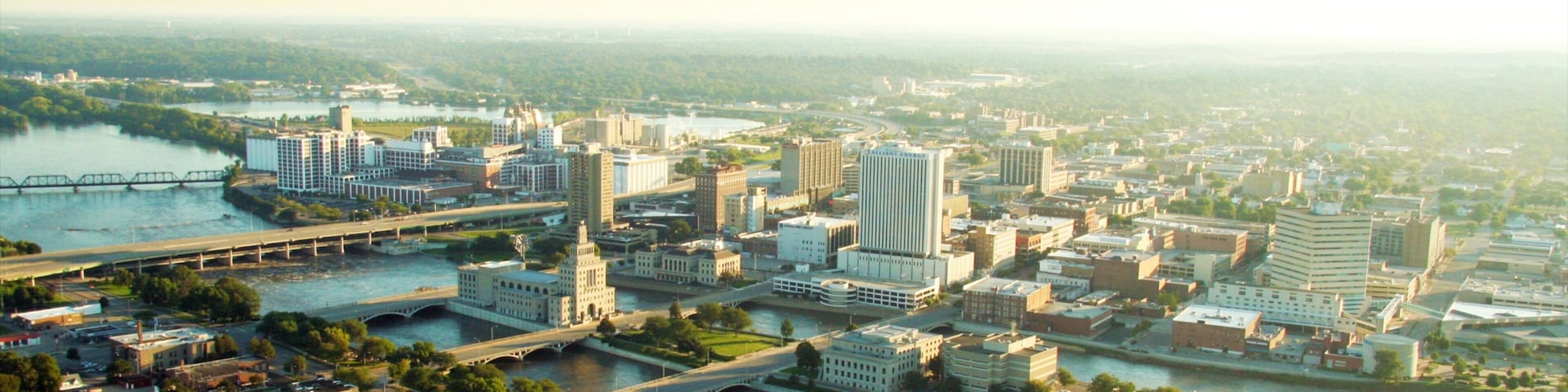 A cityscape with a river, bridges, and various buildings.