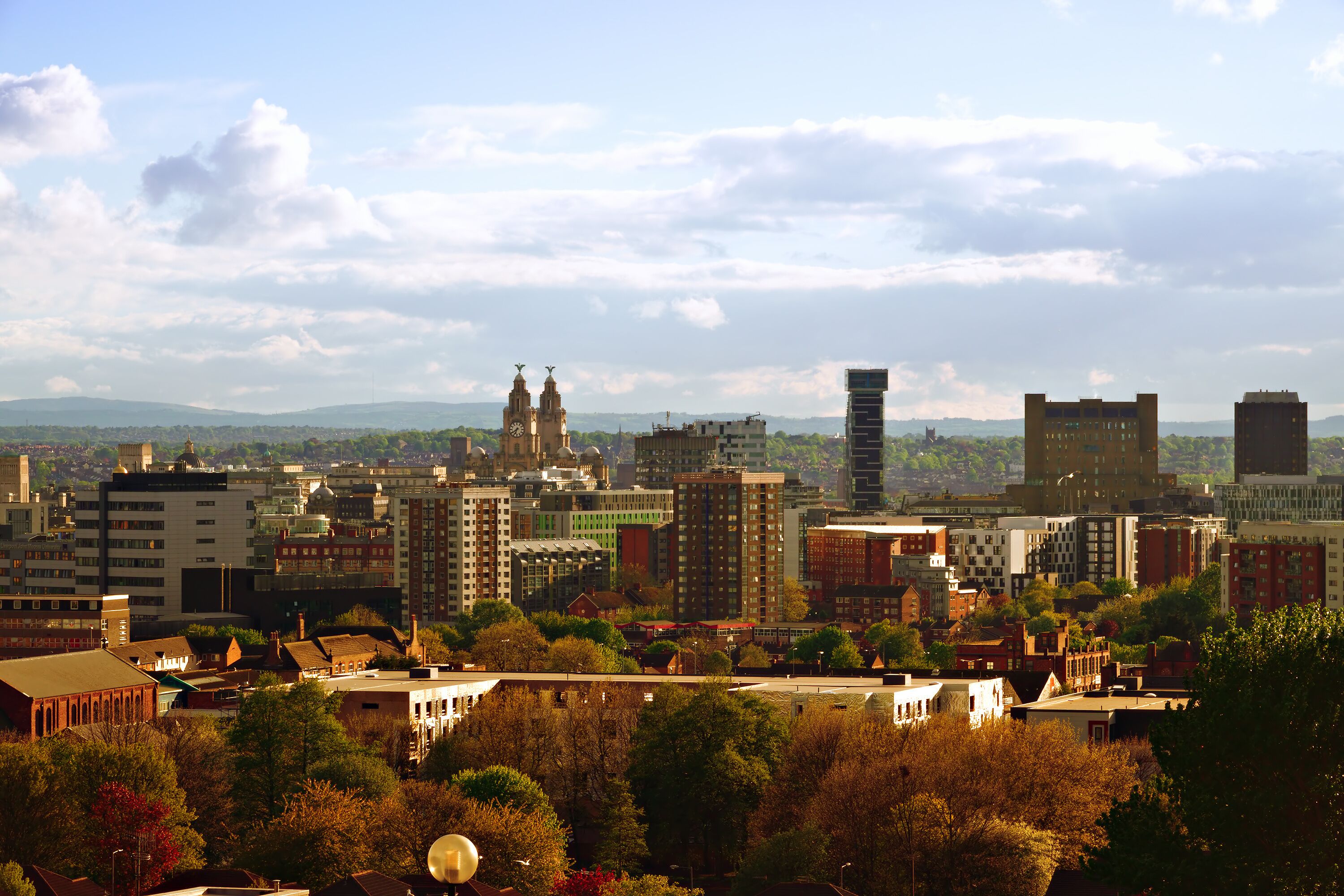 View of Liverpool's skyline with the Welsh hills in the distance taken from high up on Everton Brow