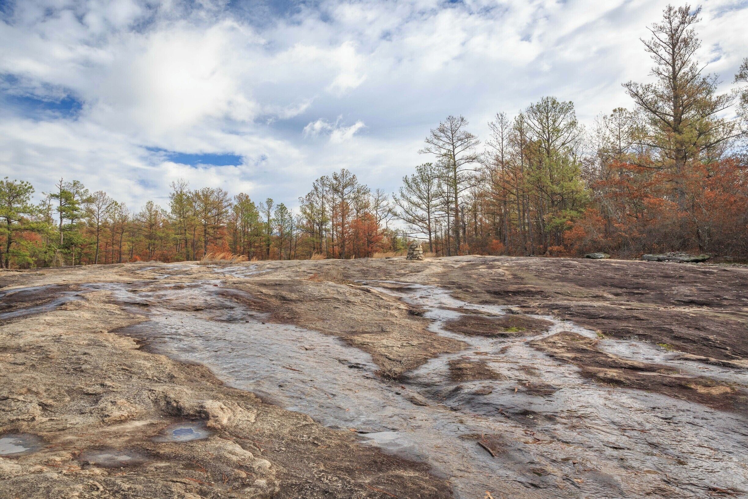 It was raining the day before and rivulets of water flowed off the granite mountain.