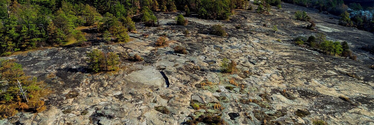 Arabia mountain, with its pitted ponds, looking onward towards the quarry remains.