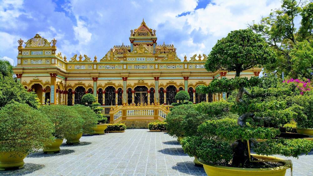 Chua Vinh Trang Pagoda, My Tho, Mekong Delta, Vietnam
This Pagoda stands in beautiful garden surroundings. There are also some big Buddah statues including a huge Happy Buddah, and other temples to see here. #packsandaplan