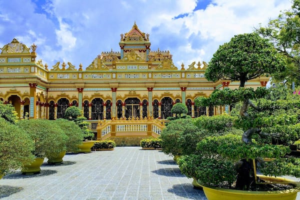 Chua Vinh Trang Pagoda, My Tho, Mekong Delta, Vietnam
This Pagoda stands in beautiful garden surroundings. There are also some big Buddah statues including a huge Happy Buddah, and other temples to see here. #packsandaplan