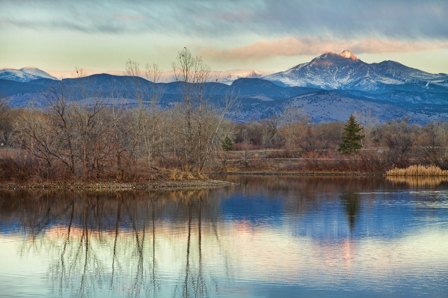 A sunrise view of Longs Peak at golden ponds in Longmont Colorado, Boulder County