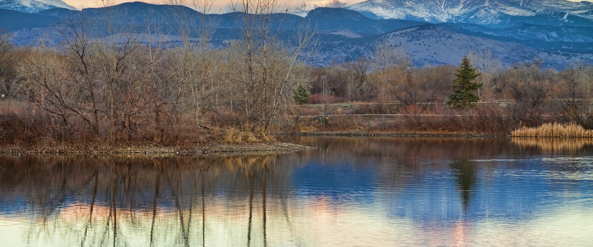 A sunrise view of Longs Peak at golden ponds in Longmont Colorado, Boulder County