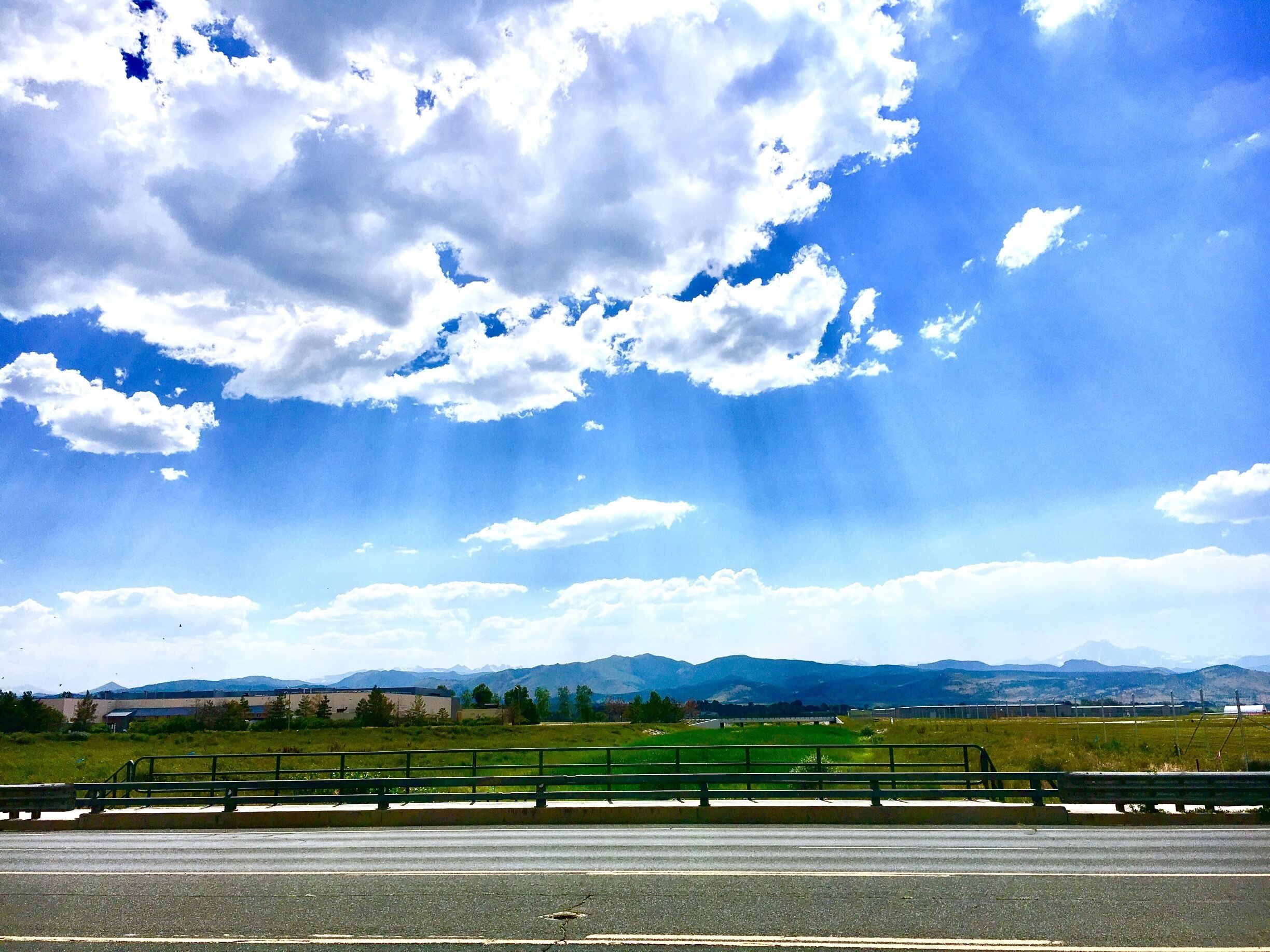 Views of the mountains from outside the Vance Brand airport in Longmont on a hot, windy day!
