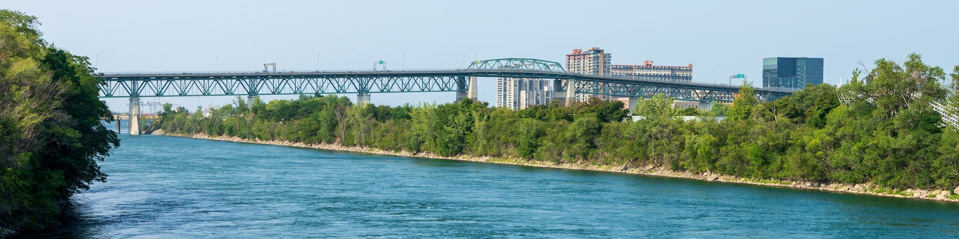 Jacques Cartier Bridge at Longueuil side. View from Notre-Dame Island. Quebec, Canada.