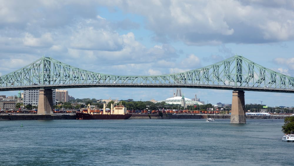 The Jacques Cartier Bridge is a steel truss cantilever bridge crossing the Saint Lawrence River from Montreal to Longueuil in Montreal, Quebec, Canada