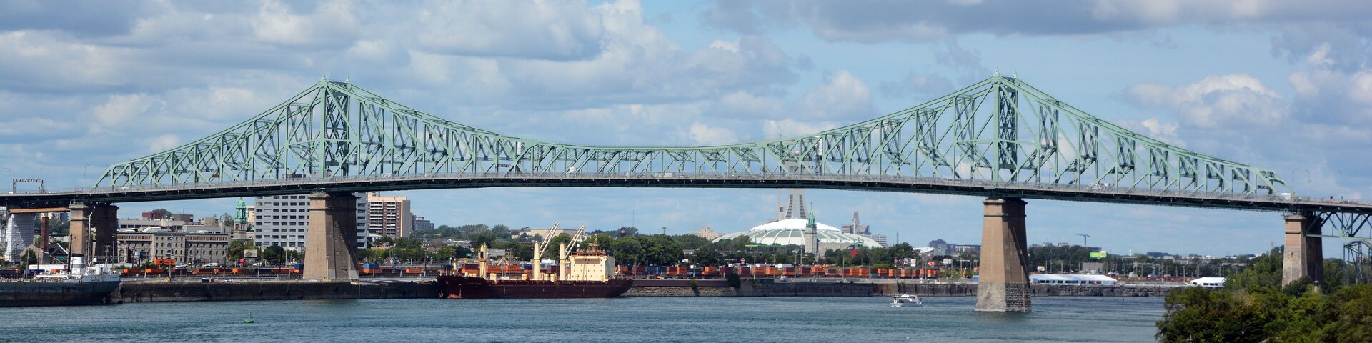 The Jacques Cartier Bridge is a steel truss cantilever bridge crossing the Saint Lawrence River from Montreal to Longueuil in Montreal, Quebec, Canada