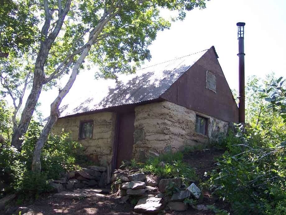 After the switchbacks take the ridge trail. You will know it's the one because you will dread going up the steep, loose gravel. It ends after the first major hill. The trail has a huge incline the entire way and isn't for the faint of heart. It passes caves and a few trees, but overall not much shade or water. The trail ends at this cabin. You can go inside. It's a general rule of thumb to use something only if you need it, and leave anything extra to be used, should somebody get stranded. 