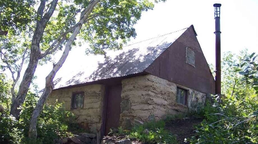 After the switchbacks take the ridge trail. You will know it's the one because you will dread going up the steep, loose gravel. It ends after the first major hill. The trail has a huge incline the entire way and isn't for the faint of heart. It passes caves and a few trees, but overall not much shade or water. The trail ends at this cabin. You can go inside. It's a general rule of thumb to use something only if you need it, and leave anything extra to be used, should somebody get stranded.