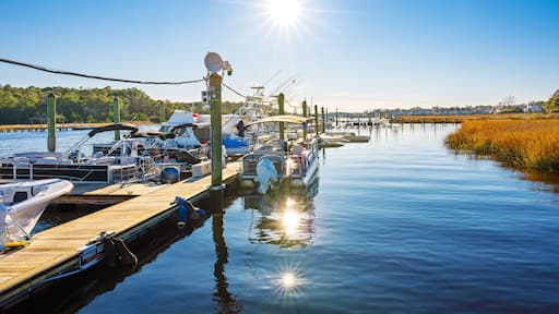 Wooden docks with fishing boats along the Intracoastal Waterway at the small town of Little River, South Carolina, in the Myrtle Beach area along the Atlantic Coast.