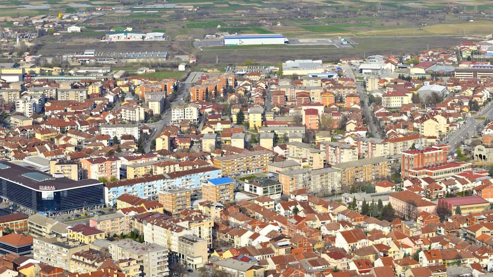 A densely built urban area with a prominent modern building labeled 'GLOBAL' and a mix of residential and commercial structures.