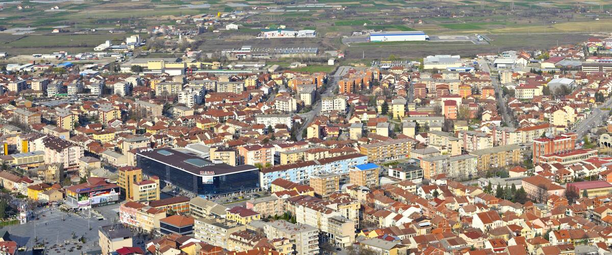 A densely built urban area with a prominent modern building labeled 'GLOBAL' and a mix of residential and commercial structures.